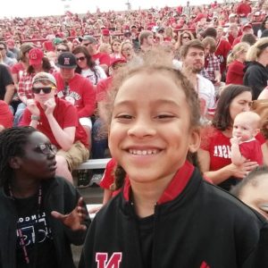 Michael in the stands at a Husker football game