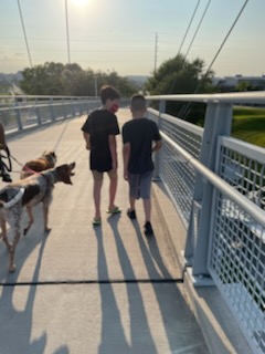 Daniel and Jonathan walking on a bridge