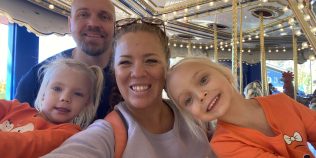 Sawyer, Brandon, Alison, and Remi take a selfie while riding the carousel at Omaha's Henry Doorly Zoo