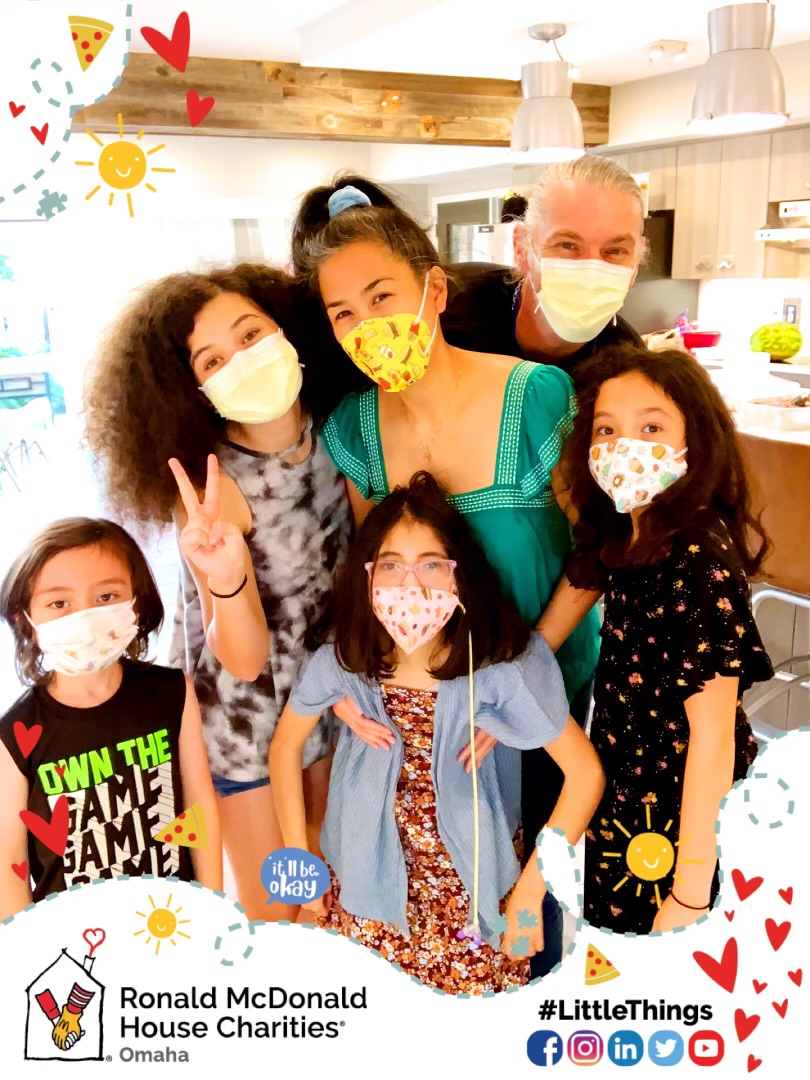 The Lucquete family poses for a selfie in the RMHC kitchen